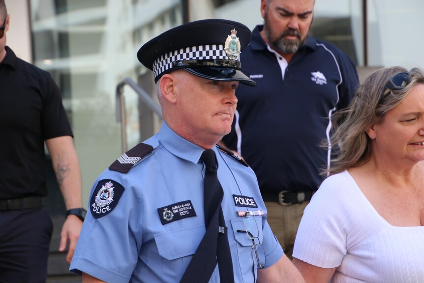 A close-up photo of a police officer outside a WA court.