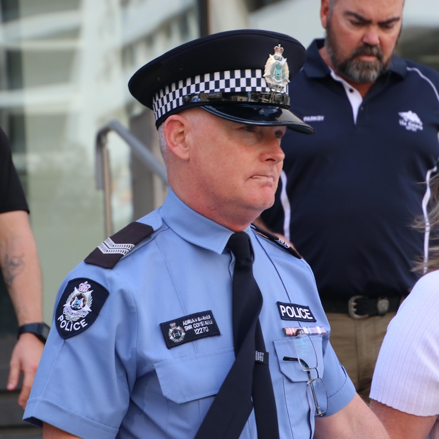 A close-up of a police officer outside a WA court.