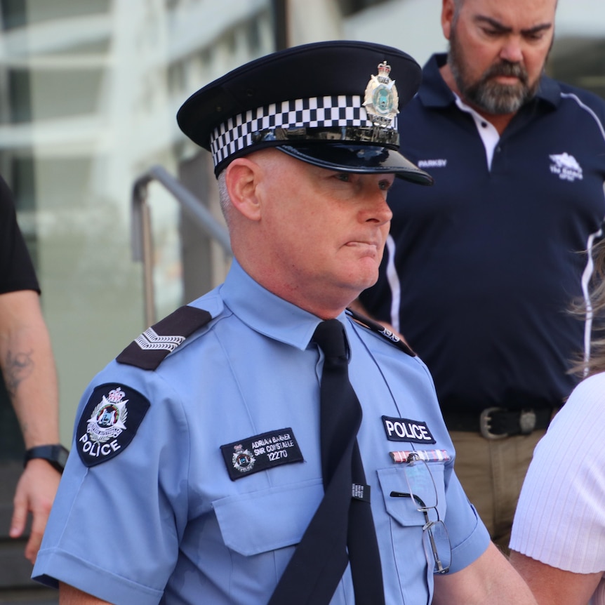 A close-up photo of a police officer outside a WA court.