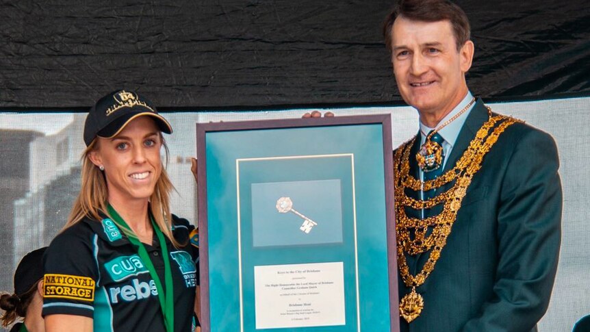 Cricket player receiving the keys to the city.