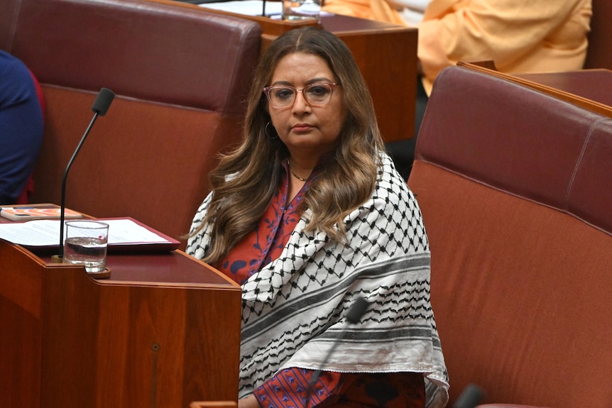 Senator Mehreen Faruqi during Question Time wearing a traditional Palestinian scarf. 