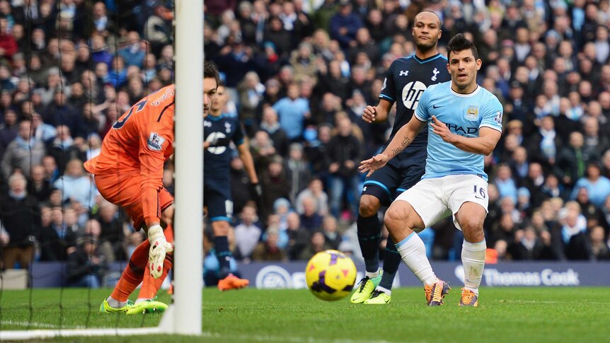 Manchester City's Sergio Aguero scores against Tottenham Hotspur in Manchester on November 24, 2013.
