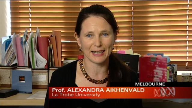 Woman sits in room, text overlay reads "Prof Alexandra Aikhenvald, La Trobe University"