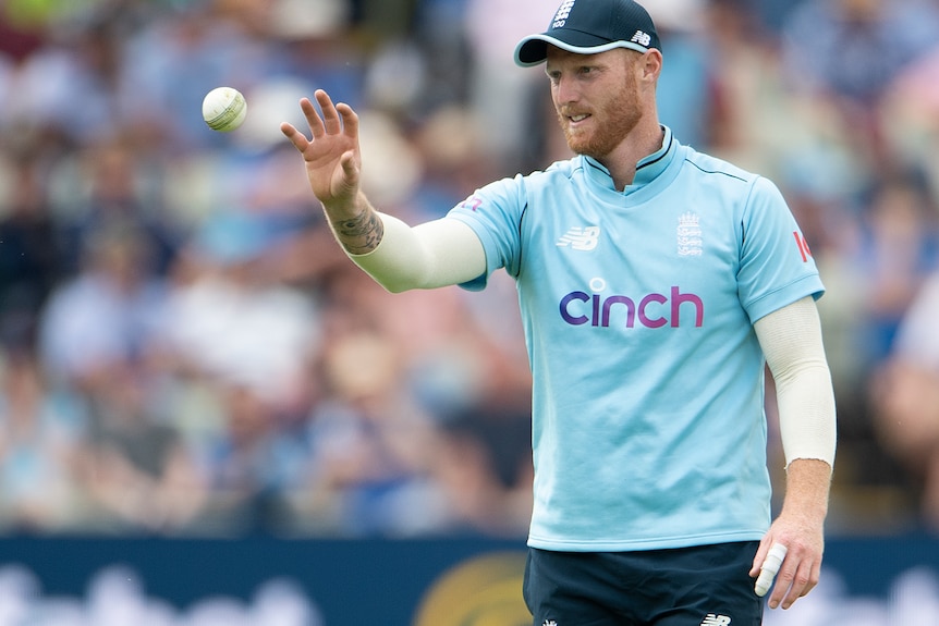 Ben Stokes catches a ball with his right hand