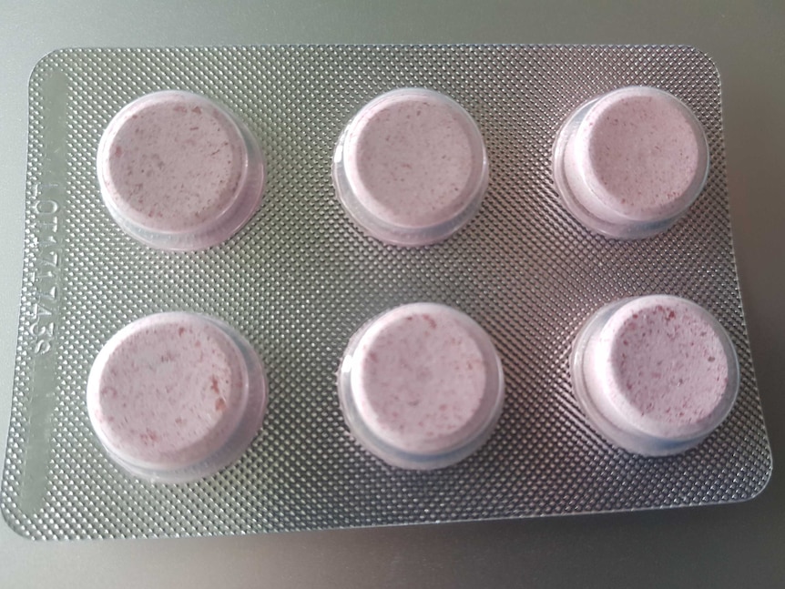 Pink tablets in a blister pack.