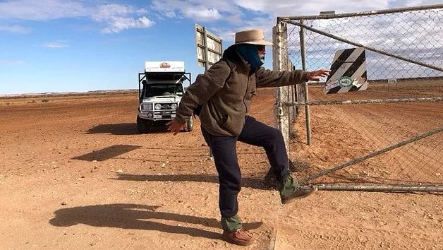 Phil mcDonald walks over the border into Queensland.