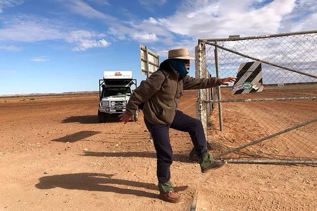 Phil mcDonald walks over the border into Queensland.