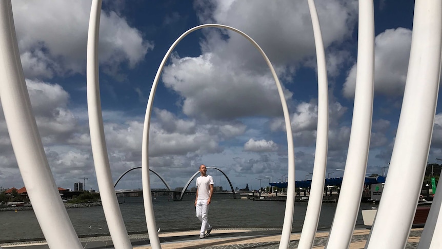 Artist Christian de Vietri with his sculpture Spanda at Elizabeth Quay in Perth