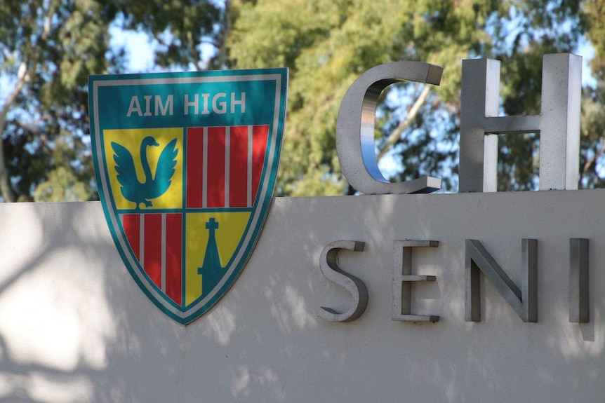 A close-up photo of the Churchlands school logo sign.