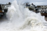A large wave crashes into a seawall in Winthrop, Massachusetts.