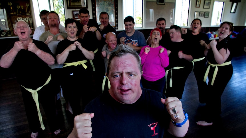 A group of people with a disability prepare for their taekwondo lesson.