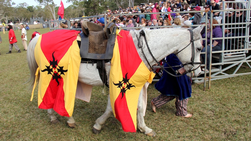 Nicky Willis' horse is lead from the jousting arena at the Abbey Medieval Festival at Caboolture on July 7, 2012.