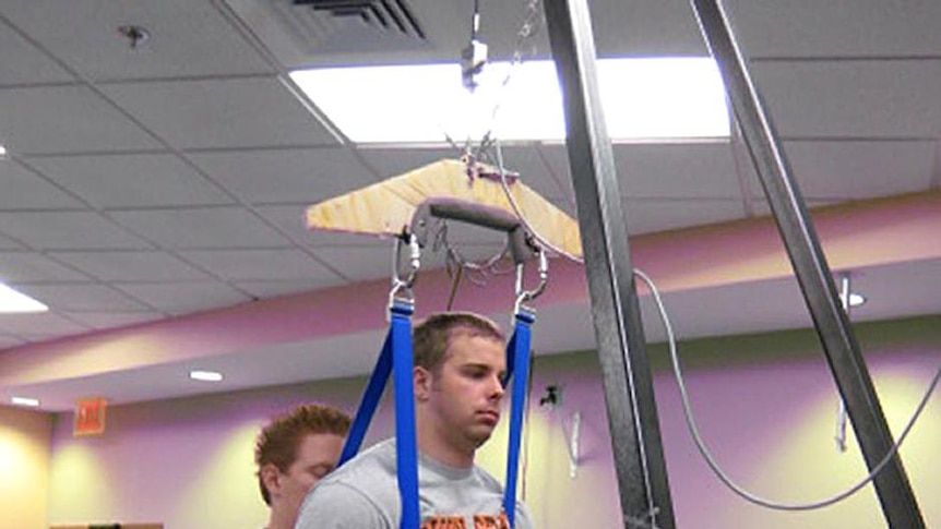 Rob Summers is moved into position on a treadmill