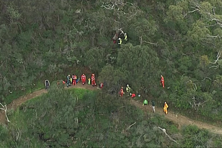 emergency services on a hiking trial among bushland