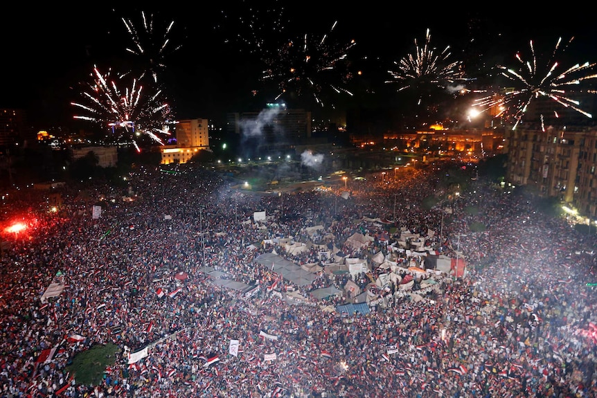Fireworks over Tahrir Square after Egypt's armed forces suspended the constitution.