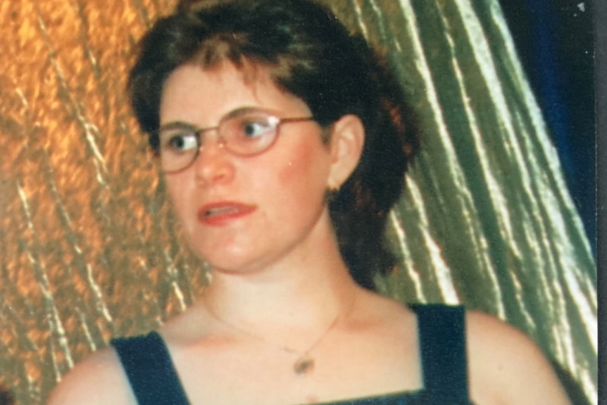 Meaghan Louise Rose, who died in a fall at Point Cartwright in 1997, holding a scroll in an undated photo