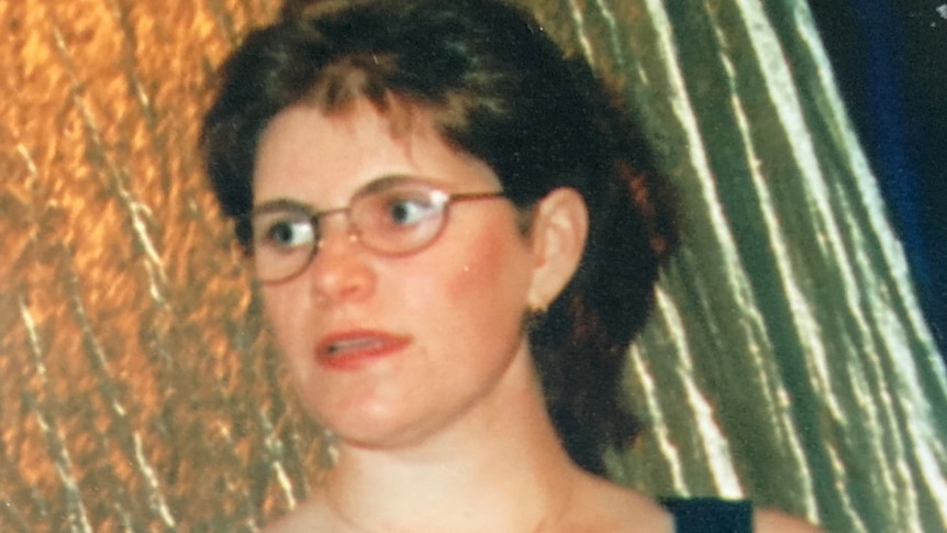 Meaghan Louise Rose, who died in a fall at Point Cartwright in 1997, holding a scroll in an undated photo