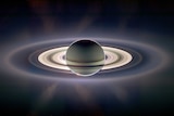 The planet Saturn as seen from the Cassini spacecraft. Its rings are illuminated against dark space