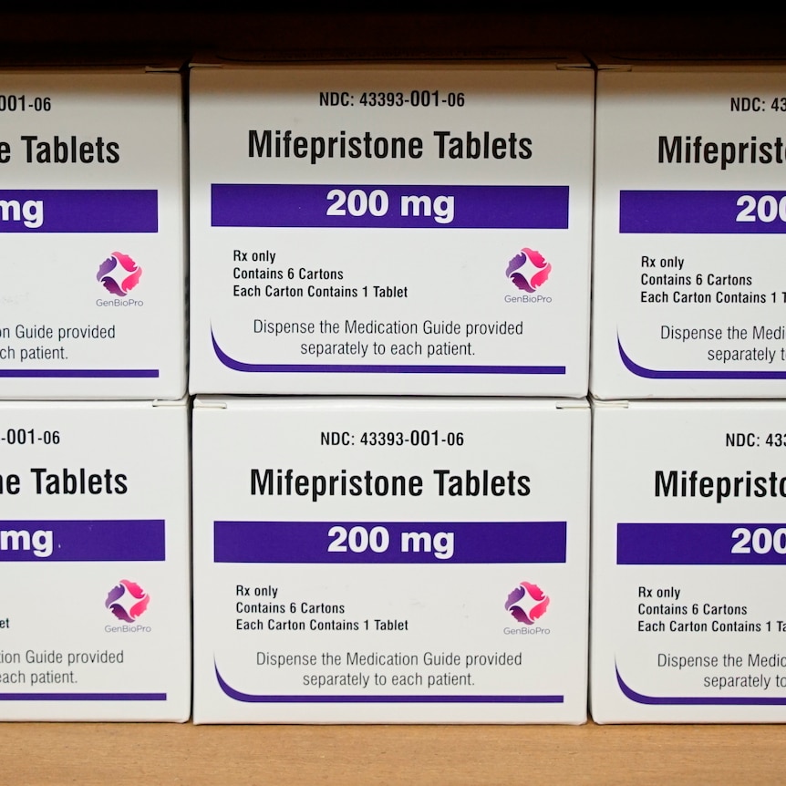 Boxes of a drug labelled 200mg mifepristone tablets sit on a shelf. 