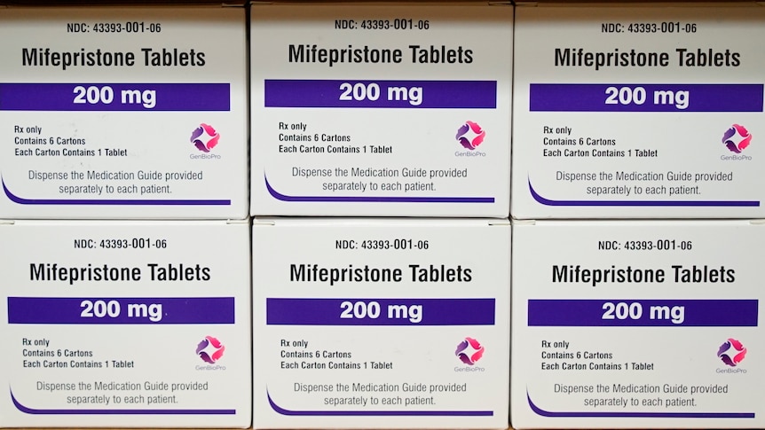 Boxes of a drug labelled 200mg mifepristone tablets sit on a shelf. 