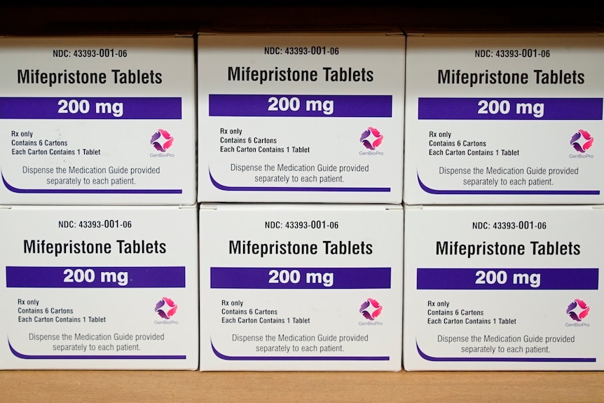 Boxes of a drug labelled 200mg mifepristone tablets sit on a shelf. 