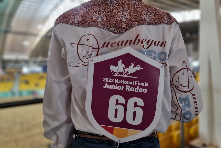 A junior rodeo competitor number on the back of a shirt.