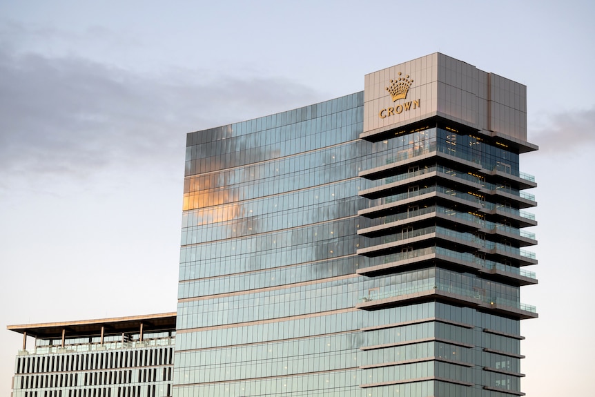 The Crown Towers building in Perth with the sun reflected in the glass.