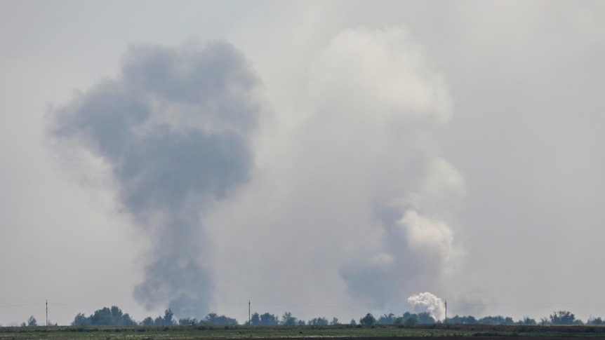 smoke rising above the area following an explosion in the village of Mayskoye in the Dzhankoi district, Crimea