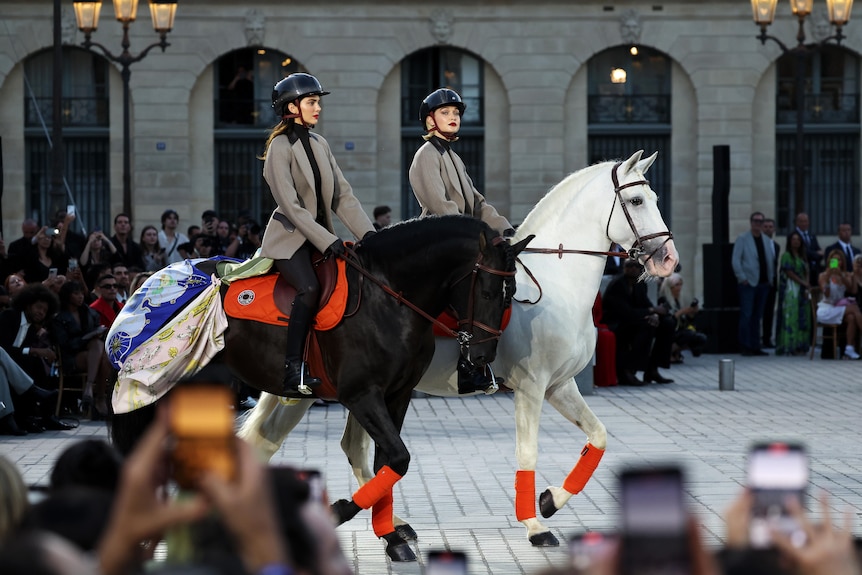 Kendall Jenner and Gigi Hadid ride horses in Paris as part of a fashion show