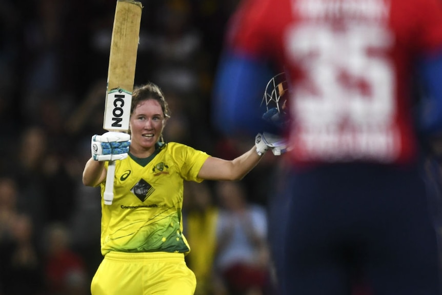 Beth Mooney of Australia celebrates her century during the third Womens Ashes T20 match.