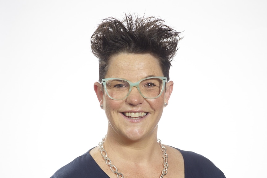 A headshot of Kimberley Malcolm wearing glasses with short brown hair from the Australian Hotels Association Victoria smiling.