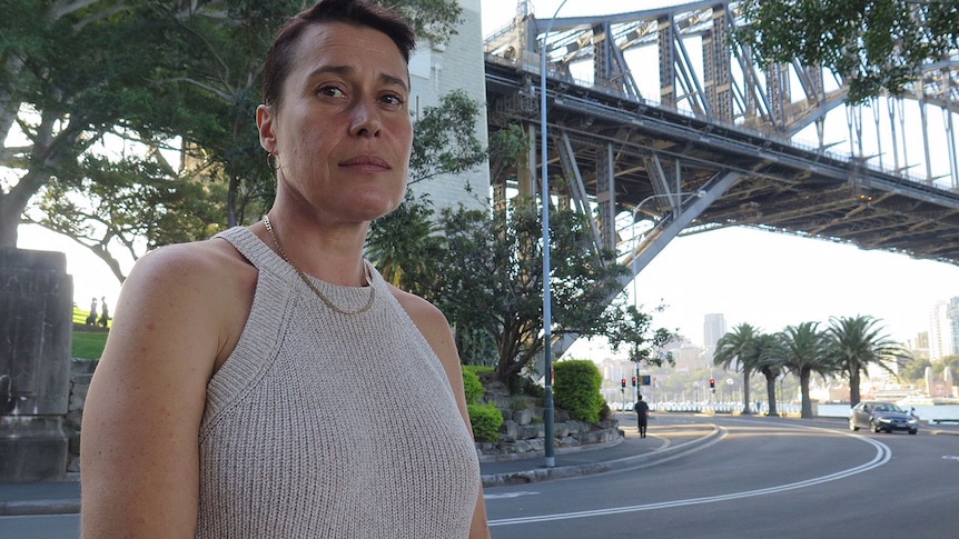 Helen McMaugh stands under the Sydney Harbour Bridge