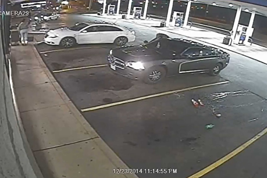 Video surveillance footage of two cars at petrol station