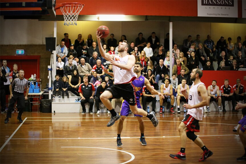 Nick Kay jumps for a lay-up for the Illawarra Hawks against Sydney Kings.