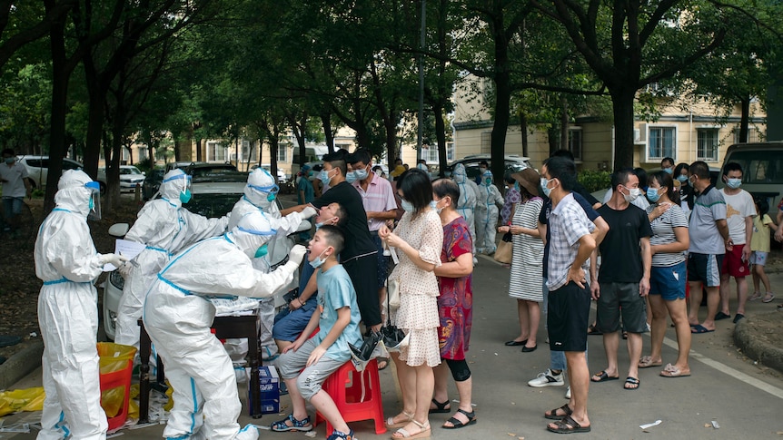 Residents line up to be tested for COVID-19 in Wuhan