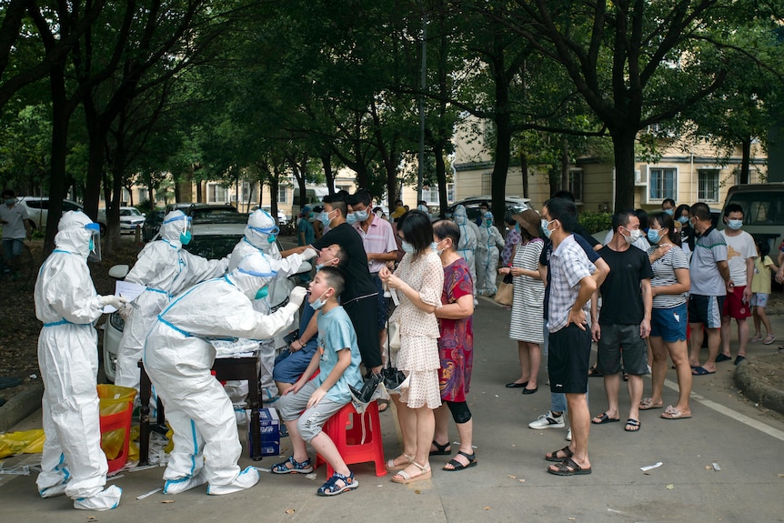 Residents line up to be tested for COVID-19 in Wuhan