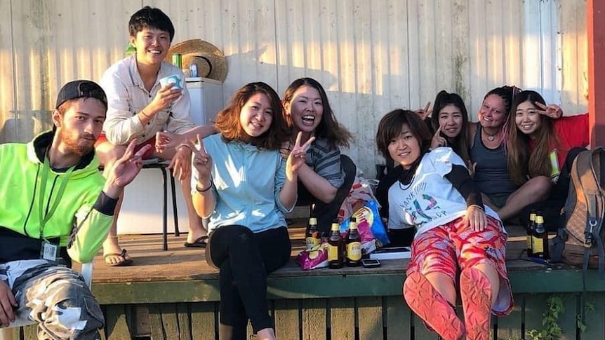 Backpackers on a verandah