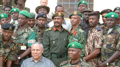 US Secretary of State Colin Powell with Sudanese troops.