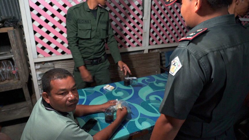 Men sit at a table