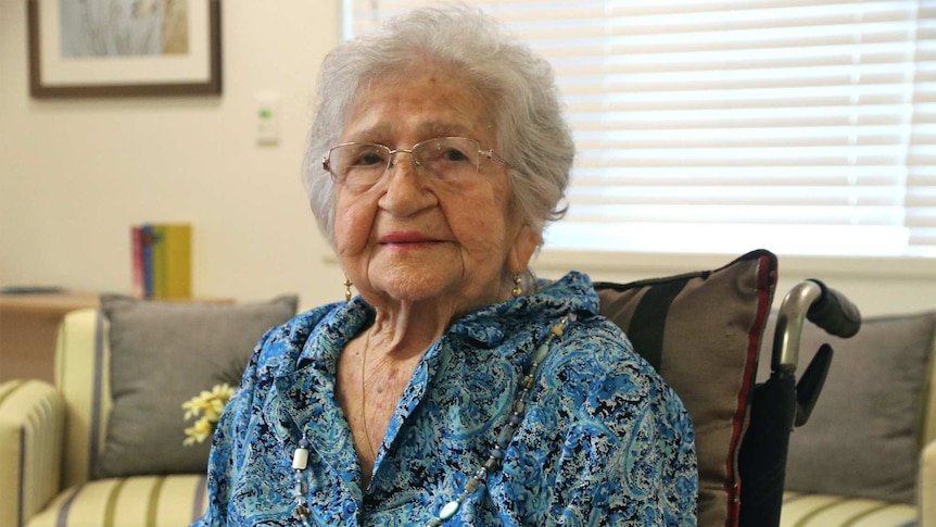 Portrait of elderly woman sitting in a wheelchair