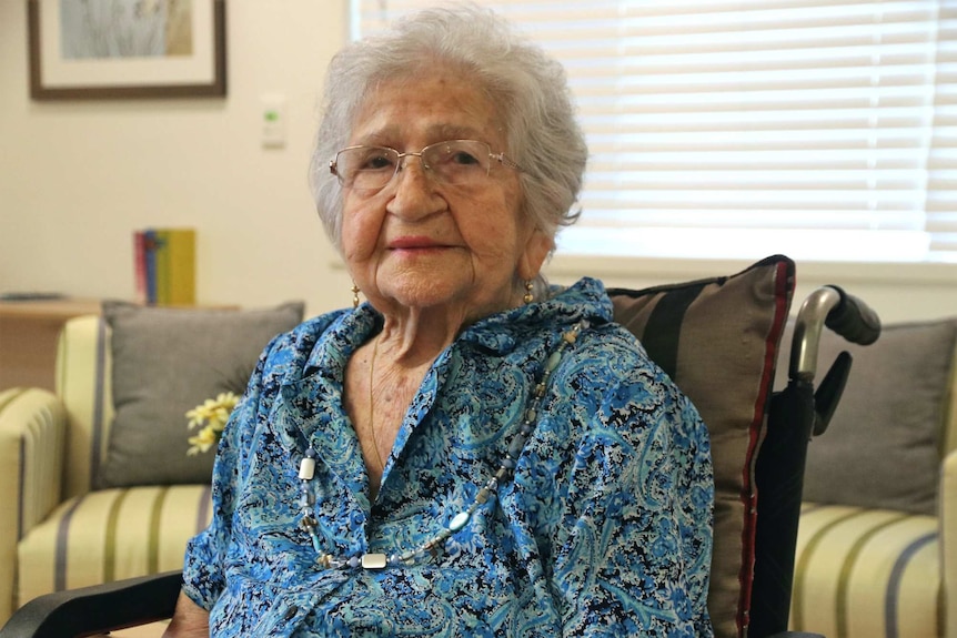 Portrait of elderly woman sitting in a wheelchair