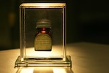 A medicine bottle in a clear case