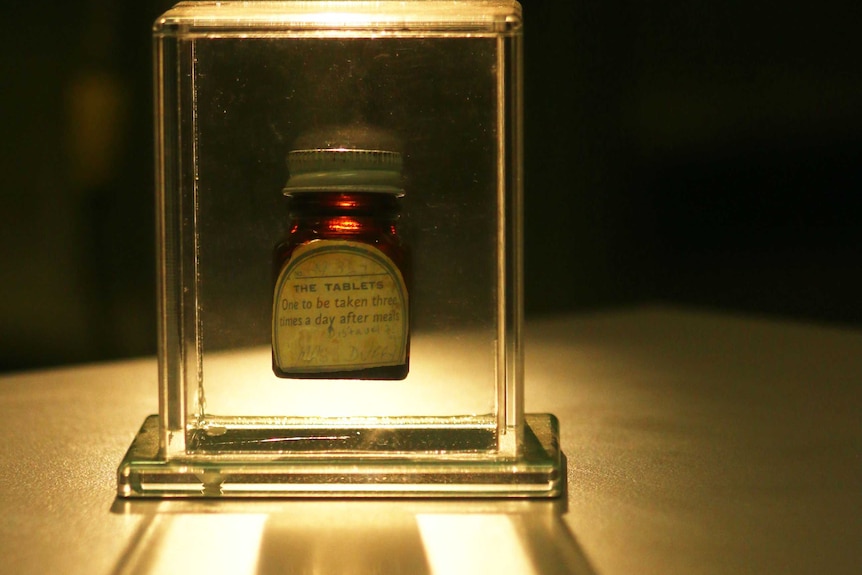 A medicine bottle in a clear case