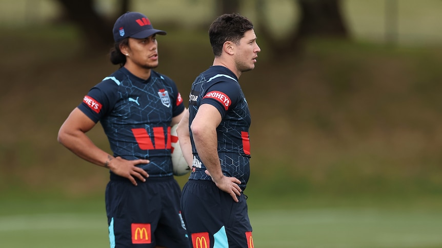 Jarome Luai stands behind Mitchell Moses at NSW State of Origin training.