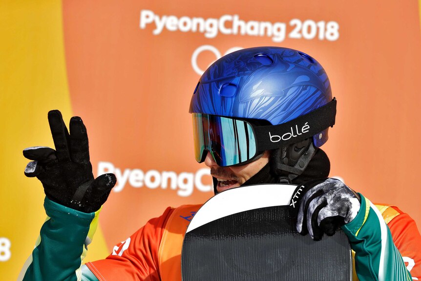 Alex Pullin smiles and waves with his helmet on at the Olympic Winter Games in Pyeongchang.