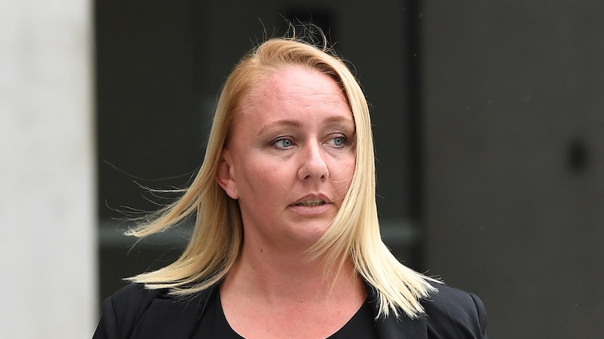 Amy Robinson, a former store manager for fitness clothing label Lorna Jane, leaves the District Court in Brisbane.