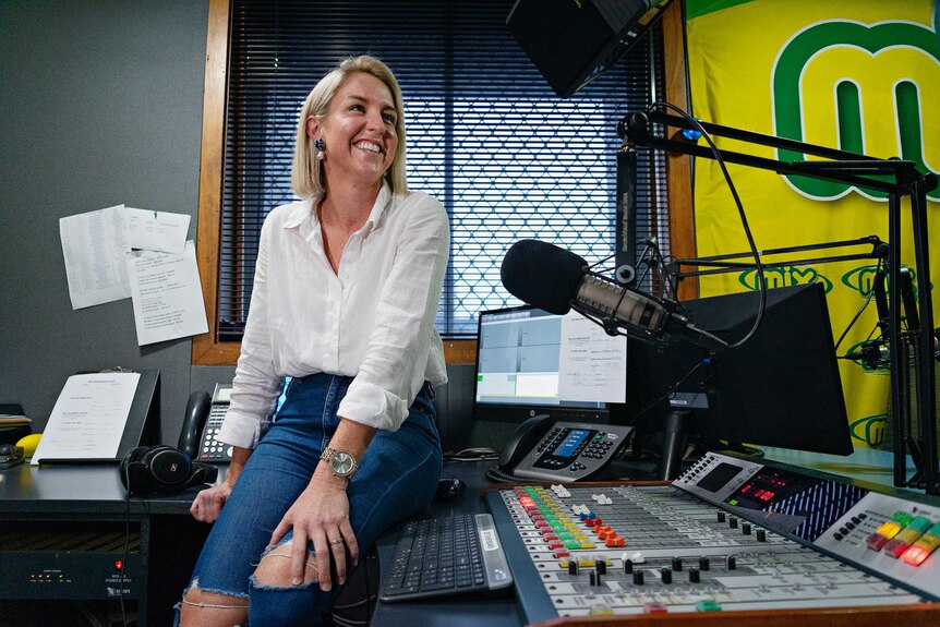 Mix 104.9 presenter Katie Woolf in the radio studio.