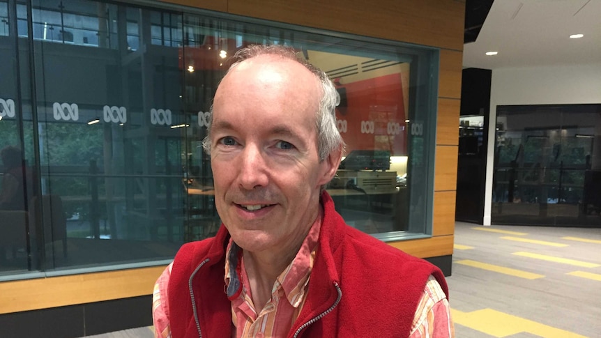 A portrait photo of Tim Hunt outside the ABC Southbank Studios