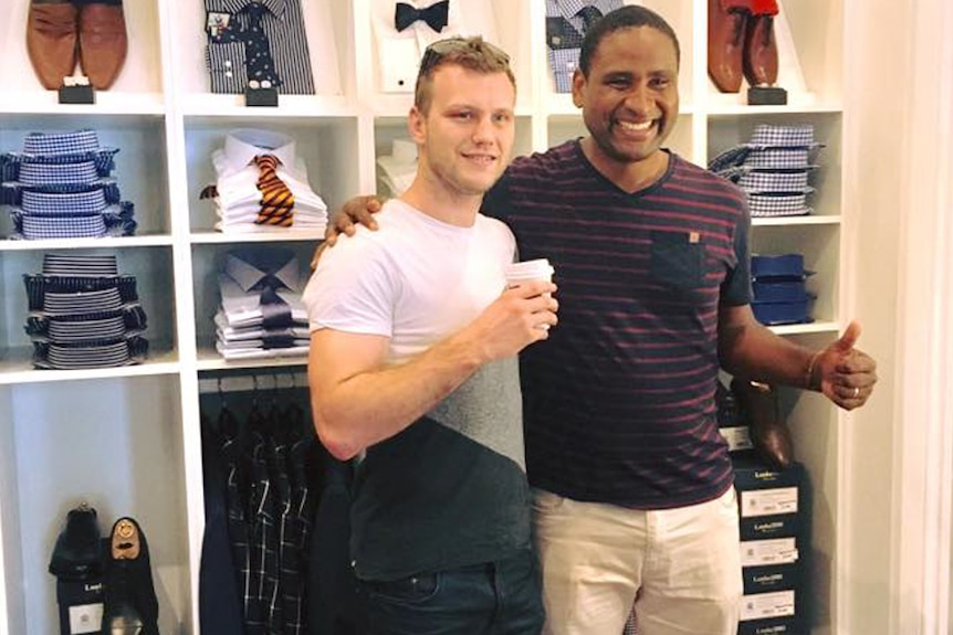 Jeff Horn and a fan in a suit store in Brisbane.