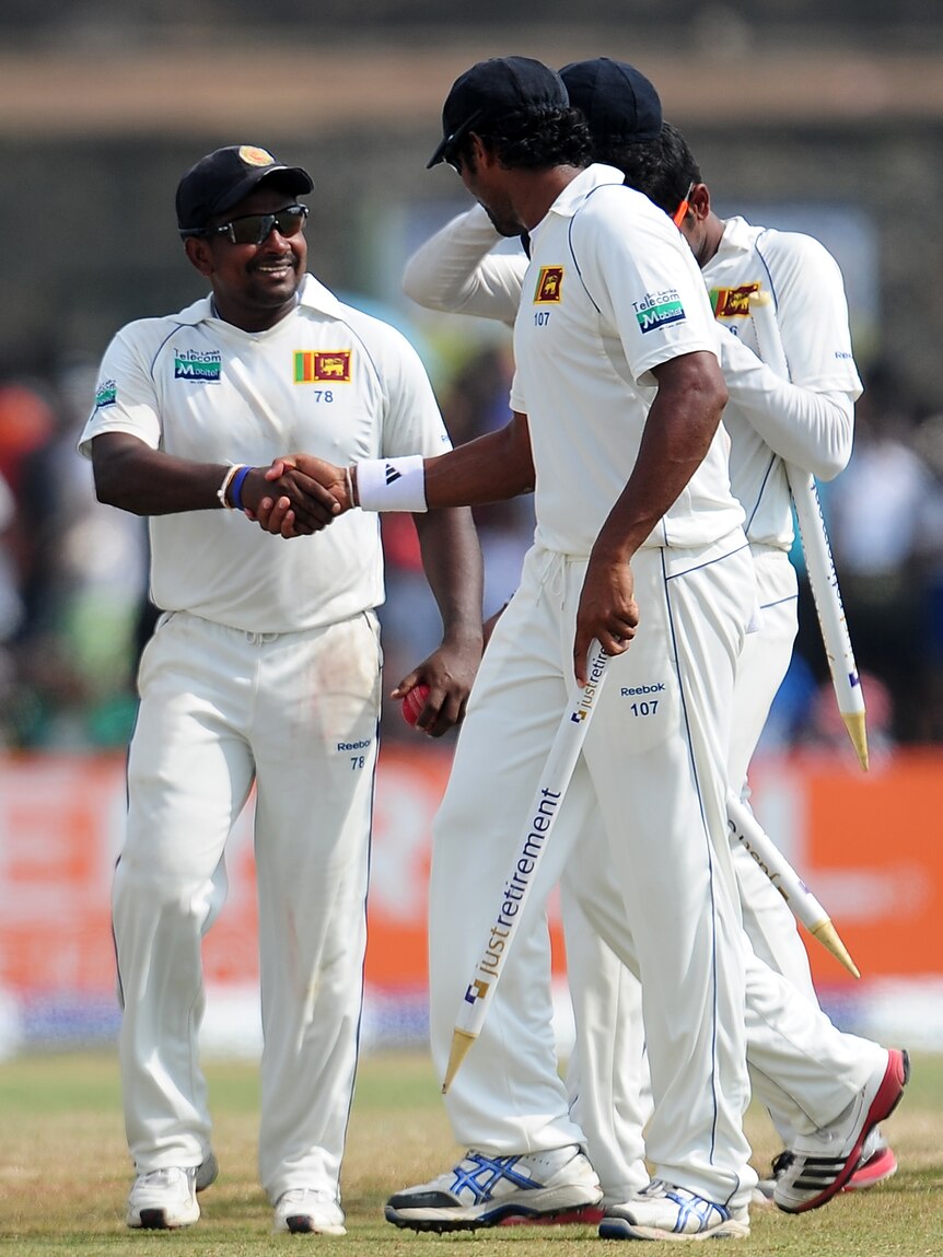 Job well done ... Herath finished with a dozen English scalps in the 75-run win.